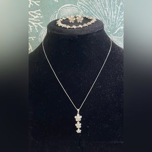 Three piece set of Sterling Silver Genuine Hawaiin Plumeria Jewelry